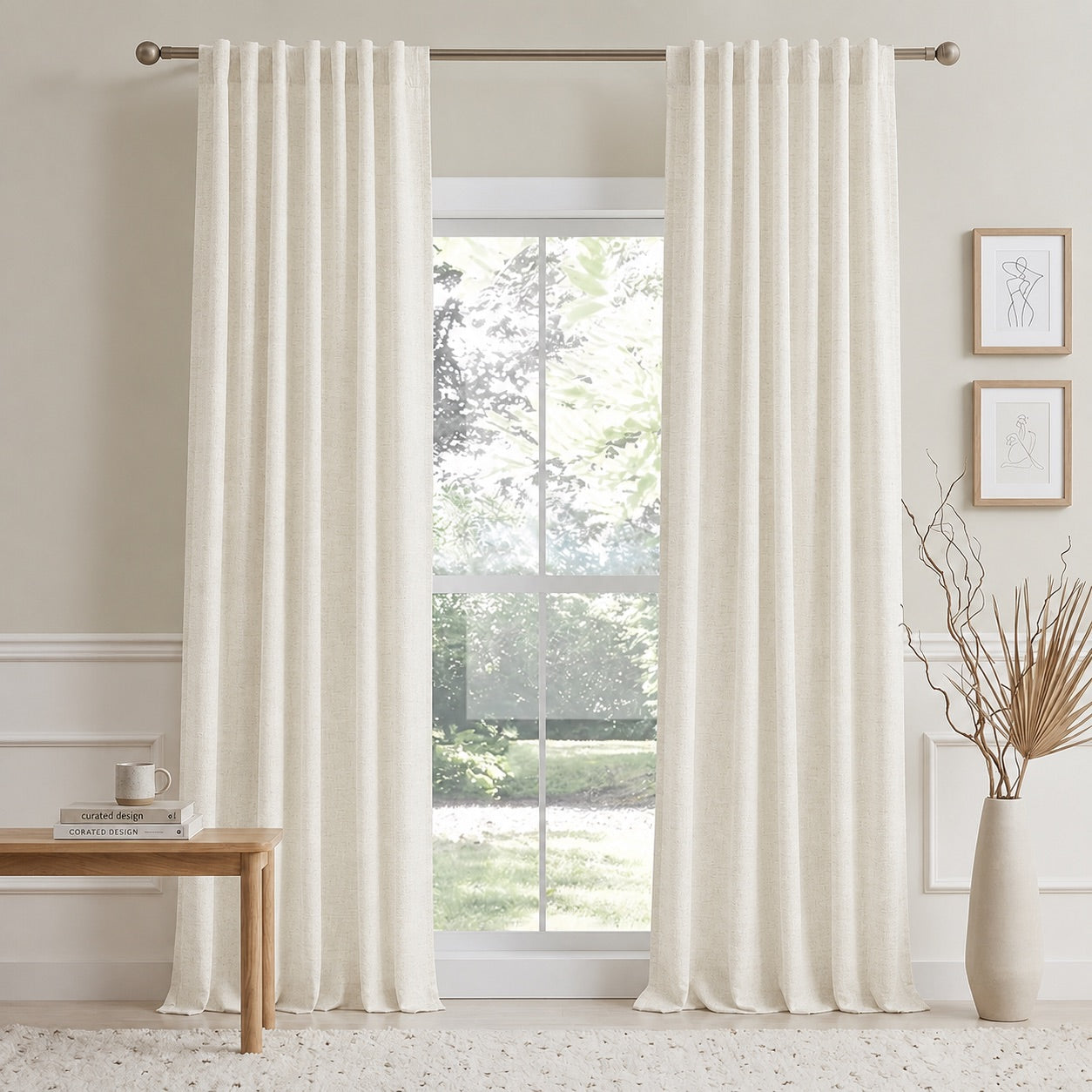 Off-white cotton-linen curtain panels with vertical pleats on a window rod