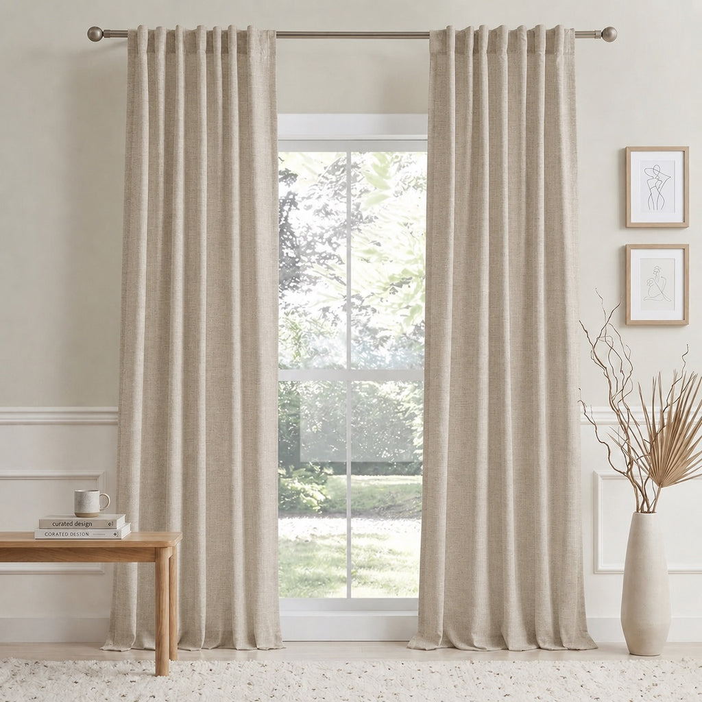 Beige cotton-linen curtain panels with vertical pleats on a window rod
