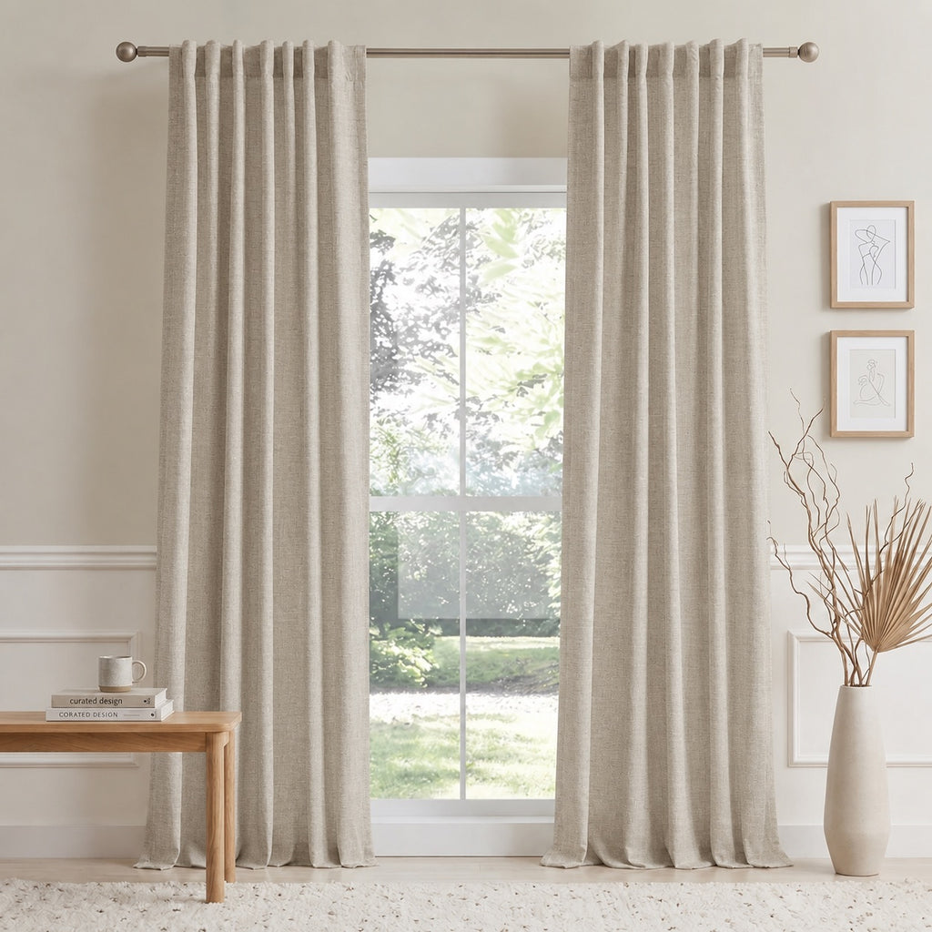 Light beige cotton-linen curtains with vertical pleats on a window rod