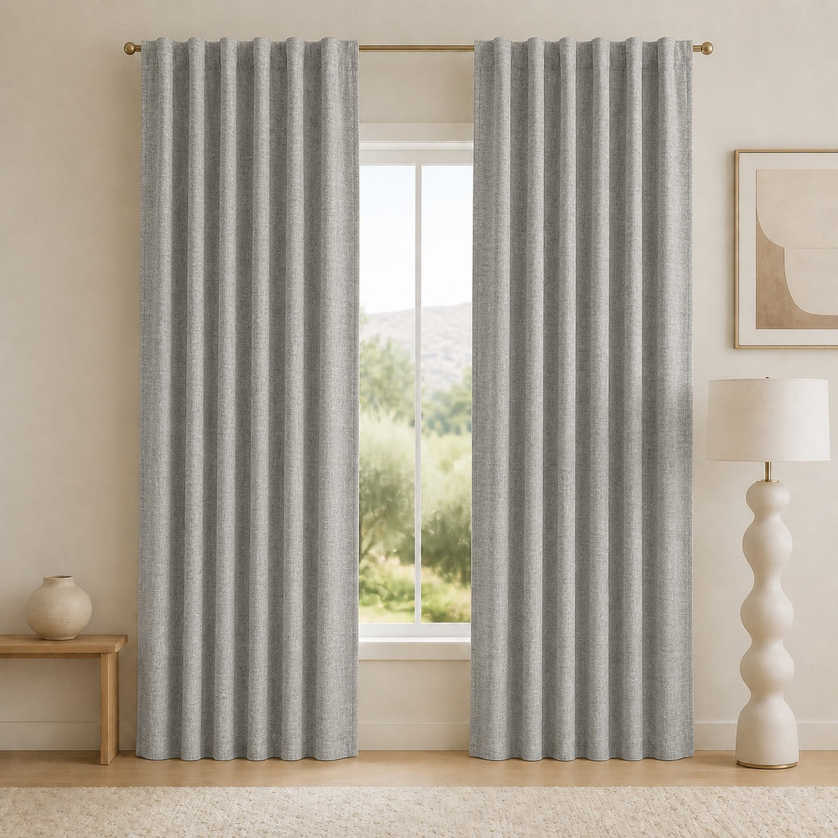 Dark gray blackout curtains with vertical pleats and grommet top, framing the window opening.
