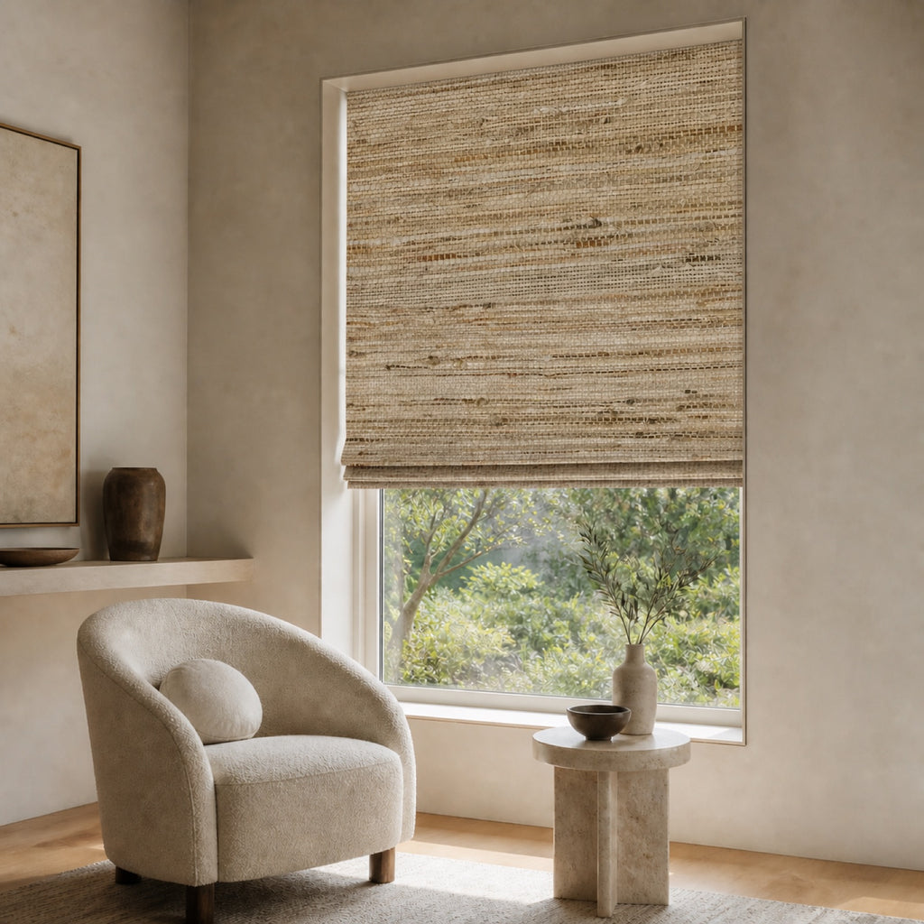 Beige woven bamboo roller shade with mixed horizontal and vertical thread pattern over a window.