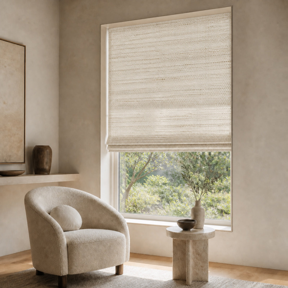Light beige woven bamboo roller shade with subtle basketweave texture over a window.
