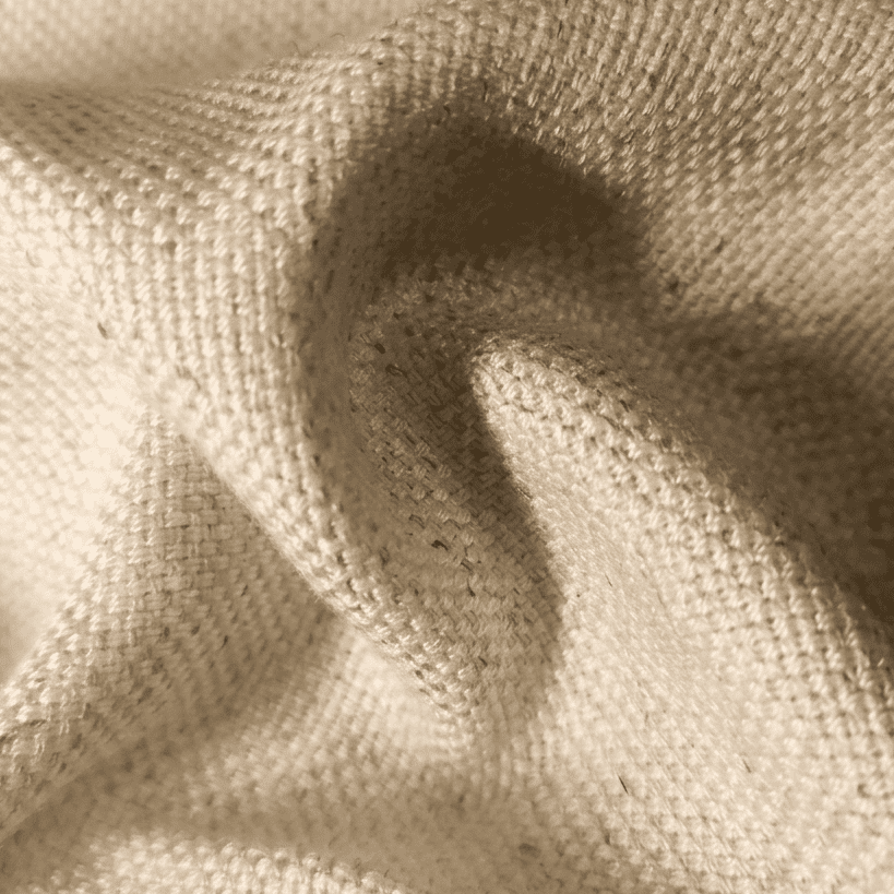 Cream linen fabric close-up showing textured weave and soft wrinkled drape
