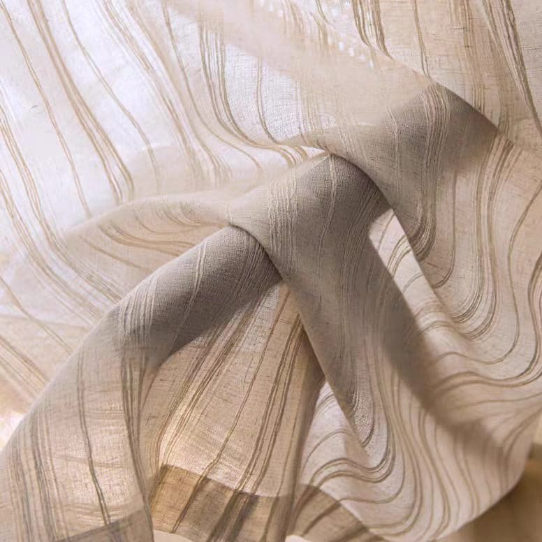 Sheer curtain fabric detail with vertical stripes and soft, light beige tone.