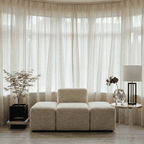 Sheer vertical stripe curtains with gathered top, flowing drape with soft texture.
