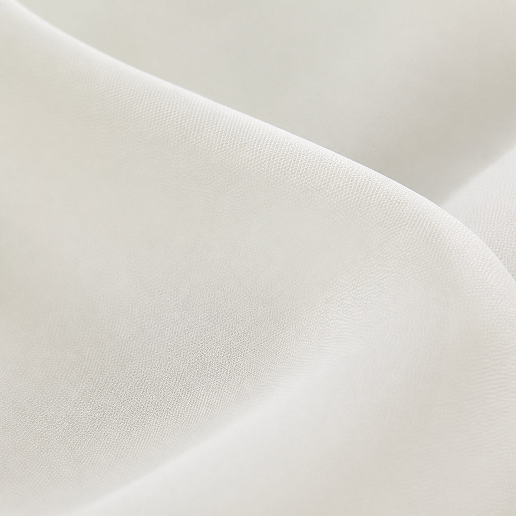 Cream sheer curtain weave close-up with smooth, semi-translucent fabric texture