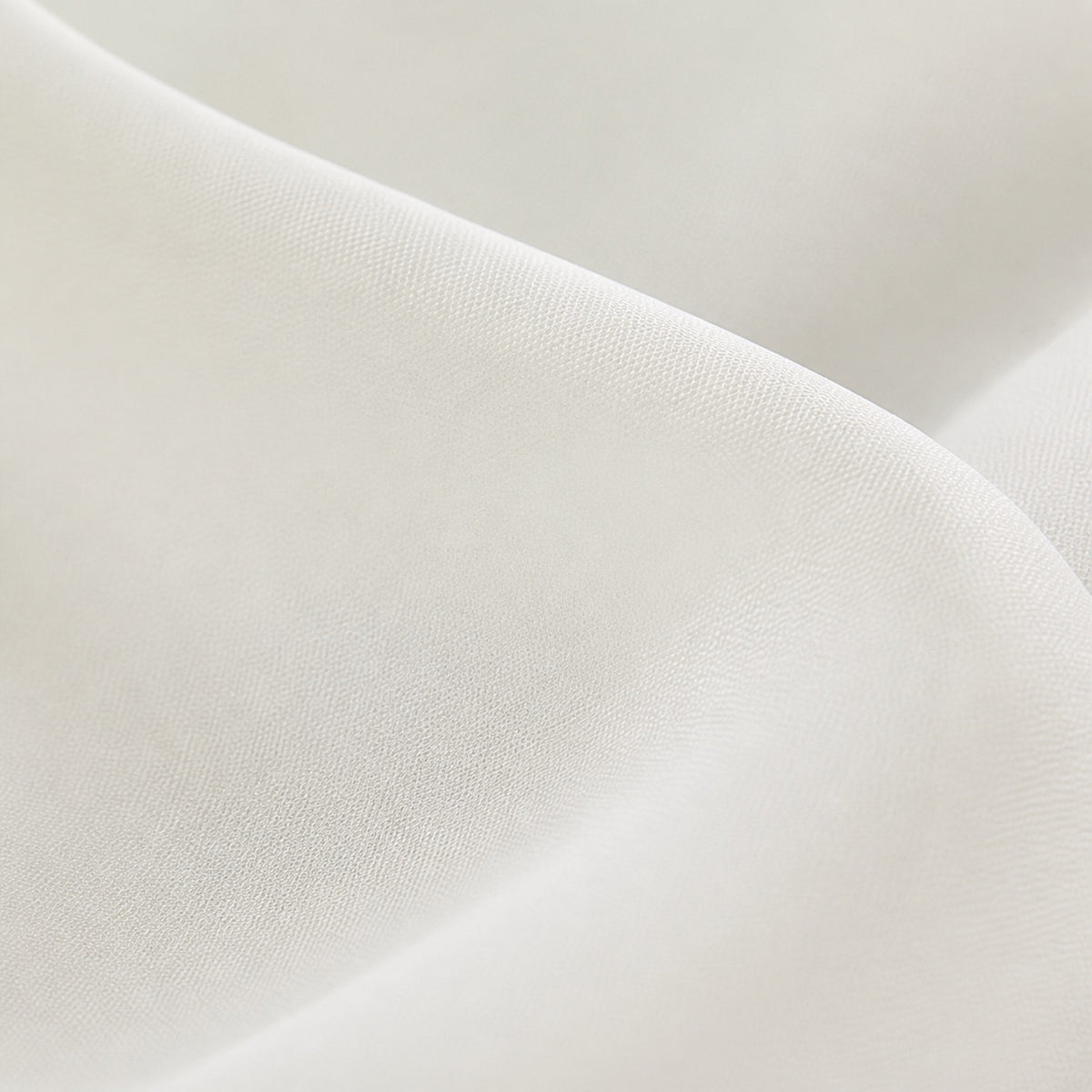 Cream sheer curtain weave close-up with smooth, semi-translucent fabric texture